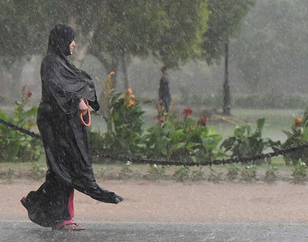 A woman walks at Rajpath