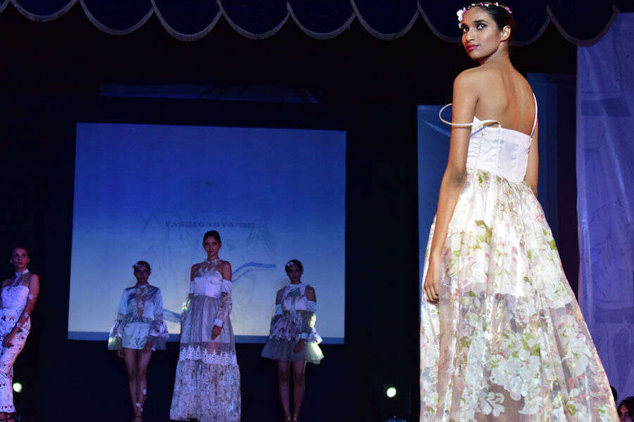 Models pose with the dresses