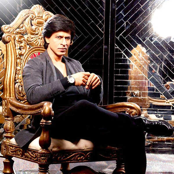 Shah Rukh Khan sitting on a chair