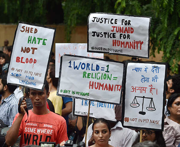 Citizens display placards during a protest