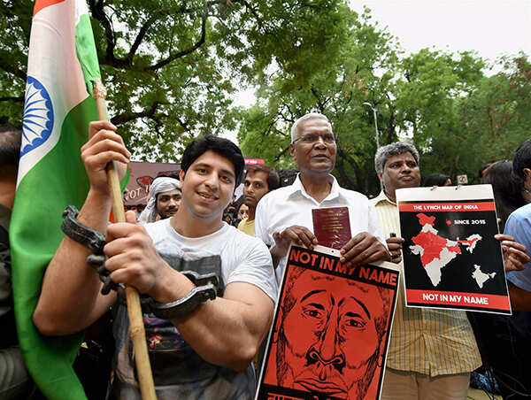 D Raja take part in a silent protest