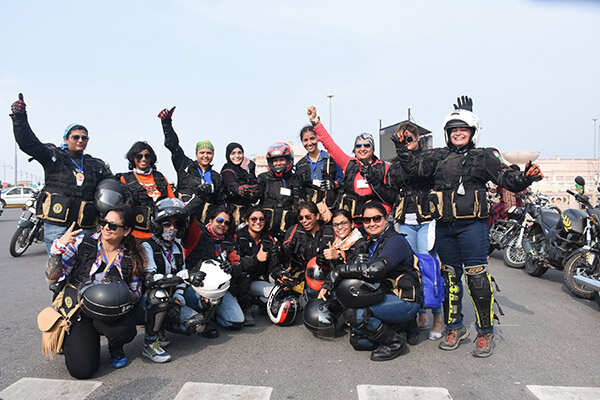 Lady bikers pose for a group photograph
