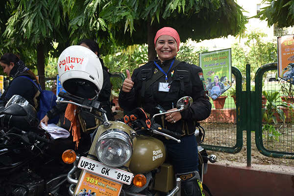 A lady biker gestures during a bike rally
