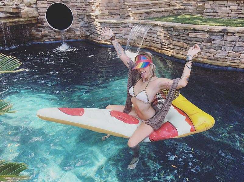 Topless Paris Jackson soaks up the sun while camping in a desert