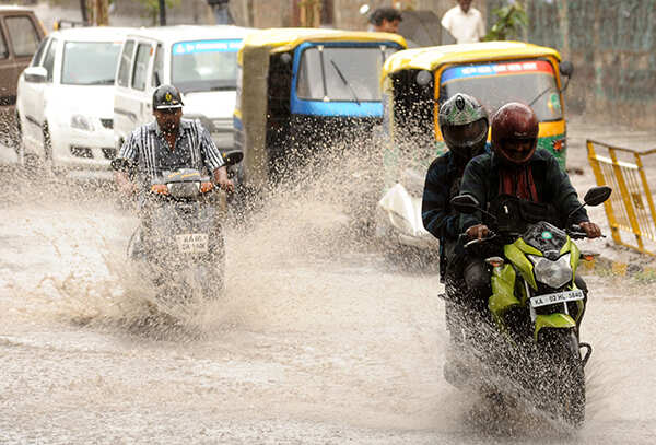 Vehicles plying on the waterlogged road