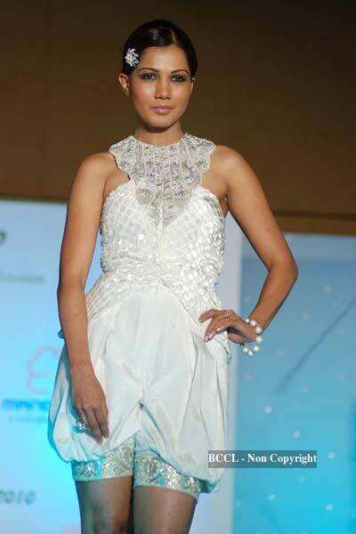 A model walks the ramp to showcase a creation during NIFT annual ...