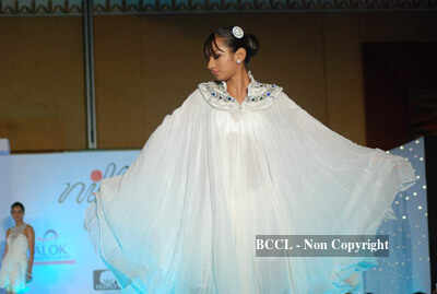 A model walks the ramp to showcase a creation during NIFT annual ...