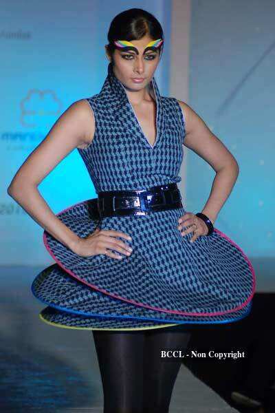 A model walks the ramp to showcase a creation during NIFT annual ...