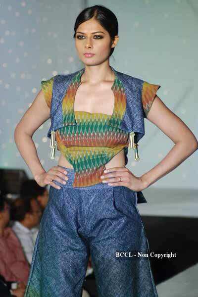 A model walks the ramp to showcase a creation during NIFT annual ...