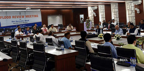 Narendra Modi attends a meeting to review the flood situation