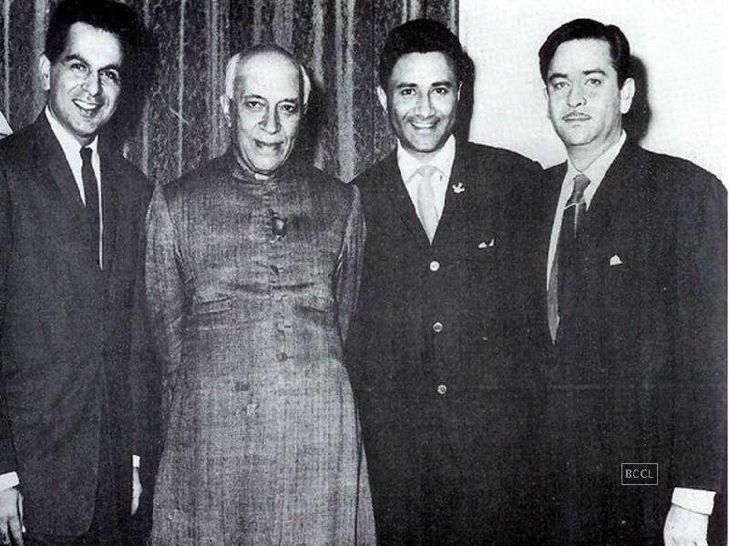 Dilip Kumar, Raj Kapoor, and Dev Anand strike a pose with Pandit Jawaharlal Nehru