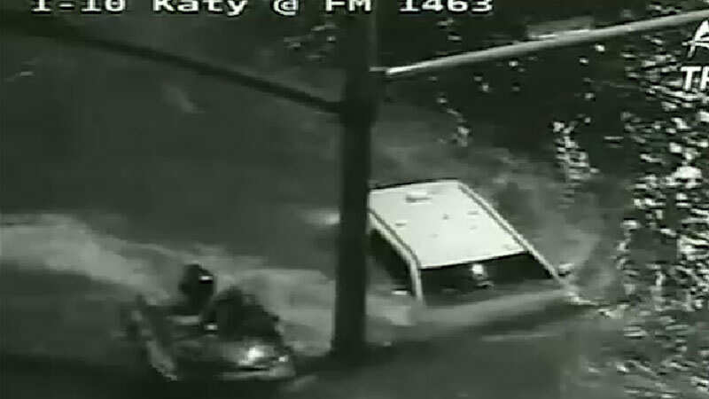 On cam: Driver rescued from submerged SUV