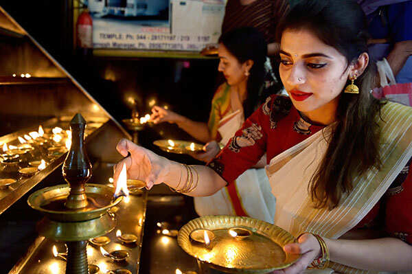 Devotees light up candles