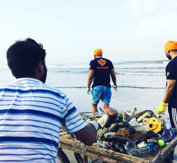 Volunteers clean up Versova beach after Ganesh Visarjan