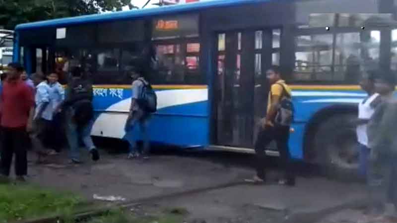 Bus stuck on railway track, close shave for passengers