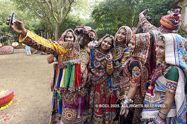 Folk dancers pose for a selfie
