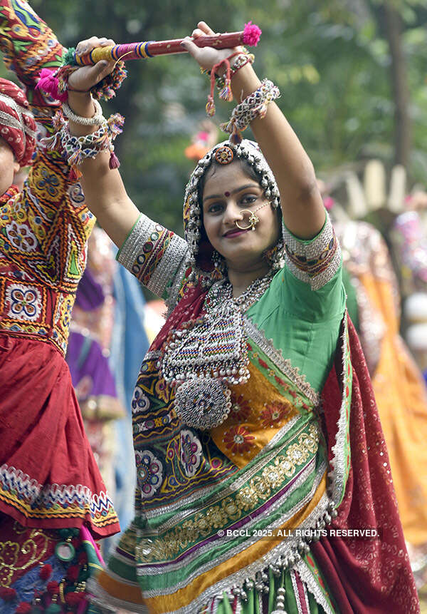 A folk dancer poses for a photograph
