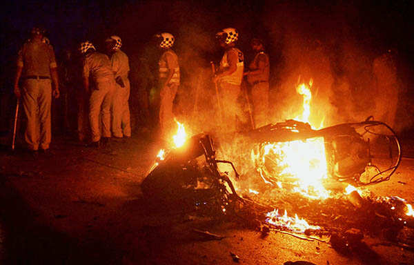A bike in flames during clashes