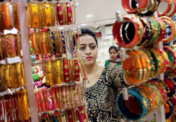 A woman buying bangles