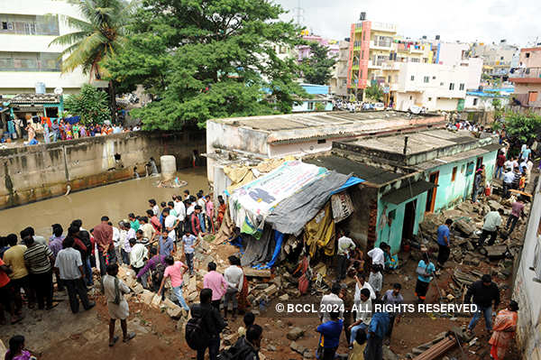 A Damaged Vehicle Is Seen In A Rain-affected Area Of Bengaluru ...