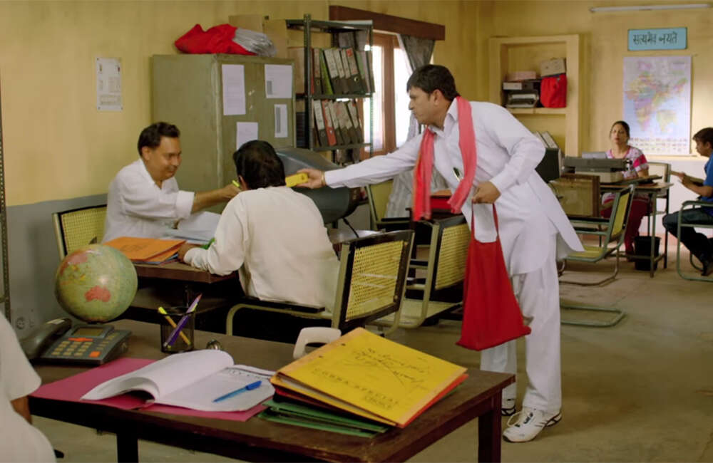 A still from Muavza: Zameen Ka Paisa