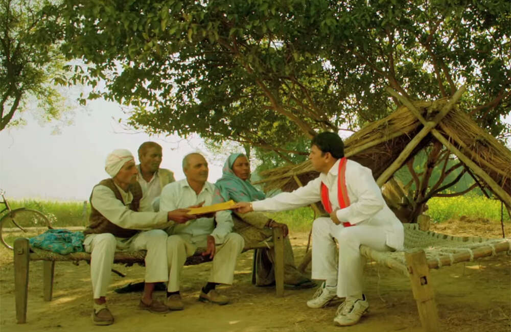 A still from Muavza: Zameen Ka Paisa