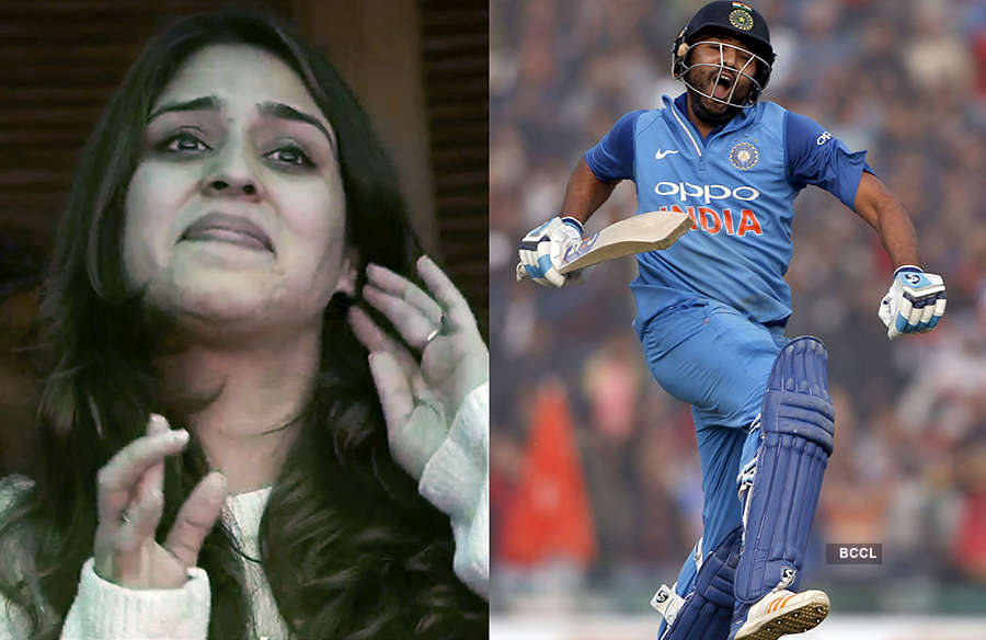 Tensed Ritika, who was standing nervously in the stadium, applauded for  hubby Rohit as he took a mere 36 balls to go from 100 to 200 run mark -  Photogallery