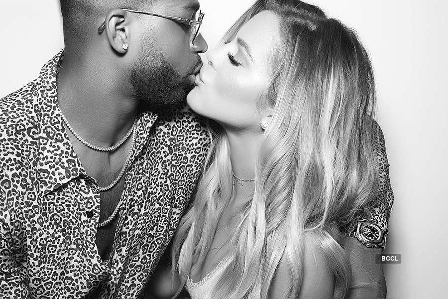 Parents-to-be Khloe Kardashian and Tristan Thompson share a passionate kiss