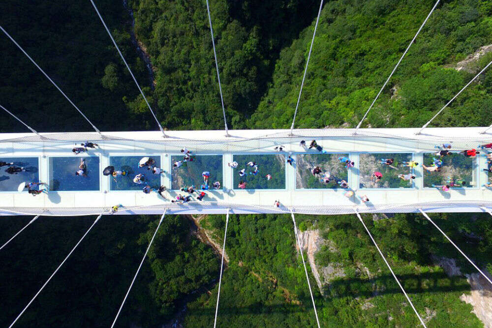 World’s highest and longest glass bridge opens in China | Times of ...