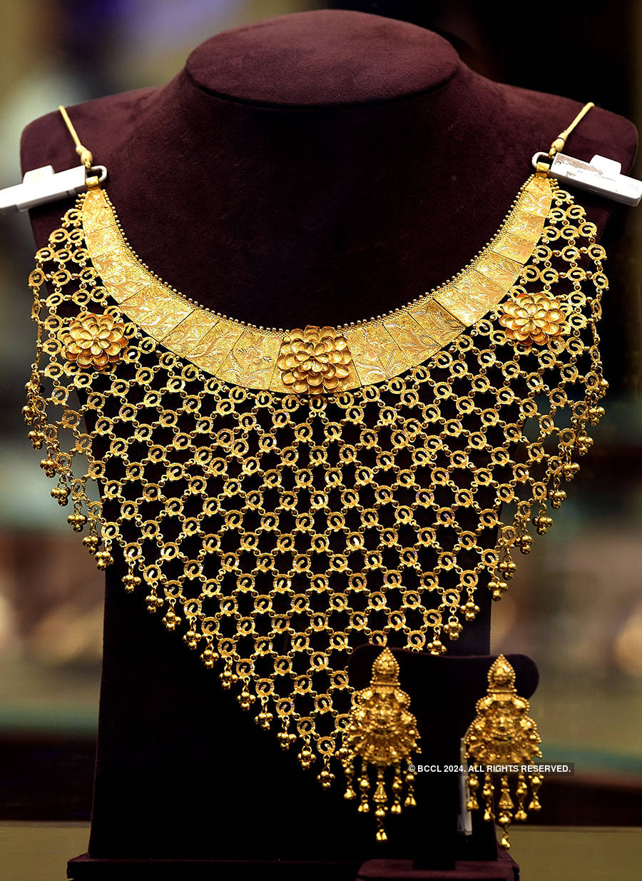 Gold loses sheen on subdued global cues, muted demand