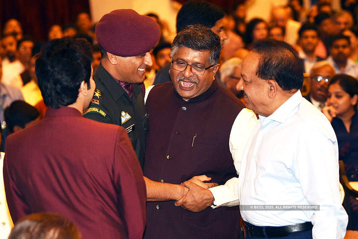 Mahendra Singh Dhoni with Ravi Shankar Prasad and Harsh Vardhan