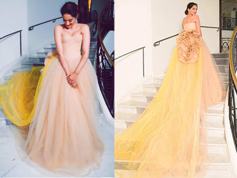 Sonam Kapoor walks the red carpet at Cannes in a nude gown with a quirky train