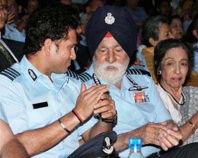 Air Chief Marshal, Arjan Singh with Sachin Tendulkar during a ceremony ...