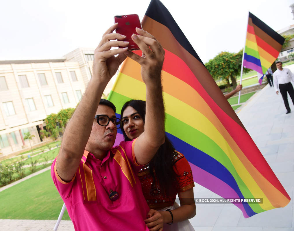 Parmesh Shahani and Nitasha Biswas attend a pride parade
