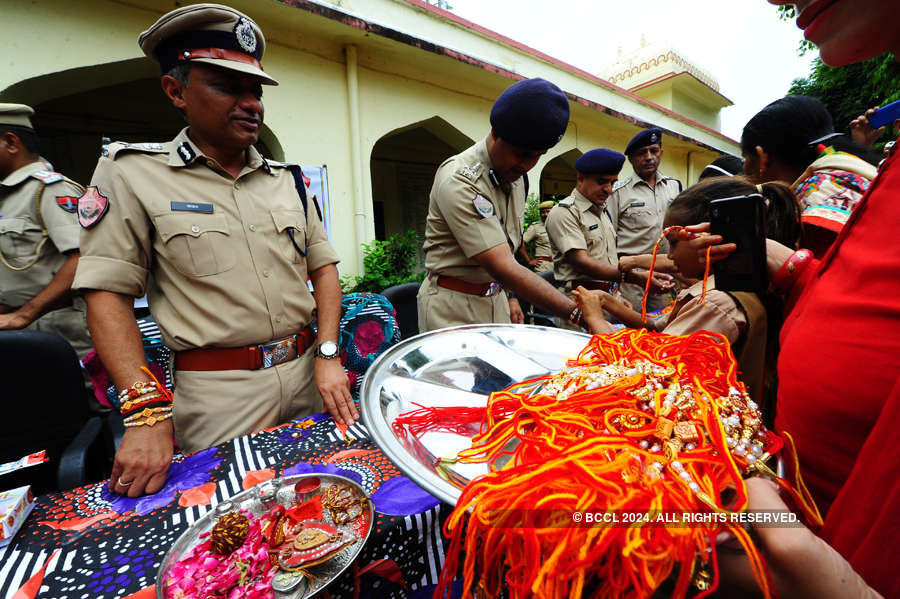 Women tie rakhis to jawans, police personnel
