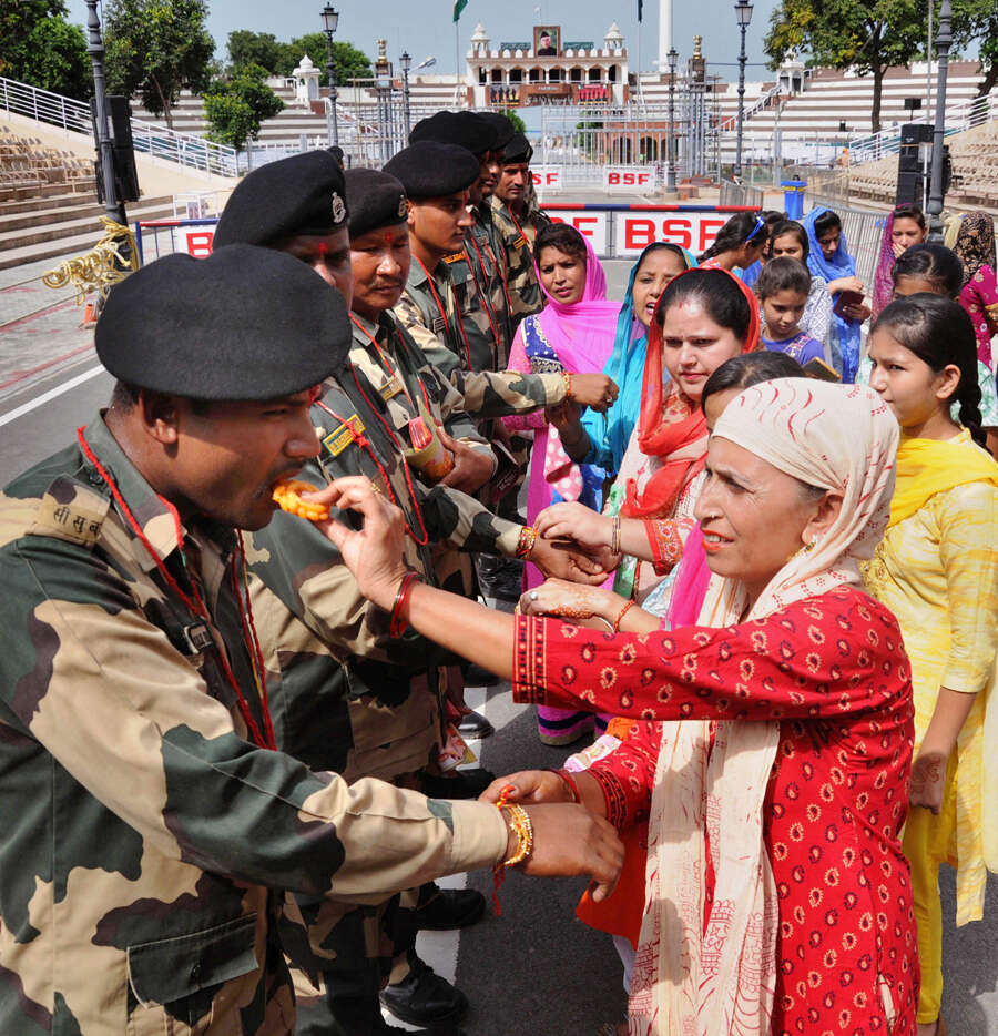 Women tie rakhis to jawans, police personnel