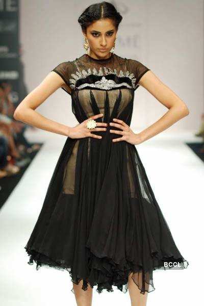 A model showcases a creation by designer Swapnil Shinde on Day 4 of ...