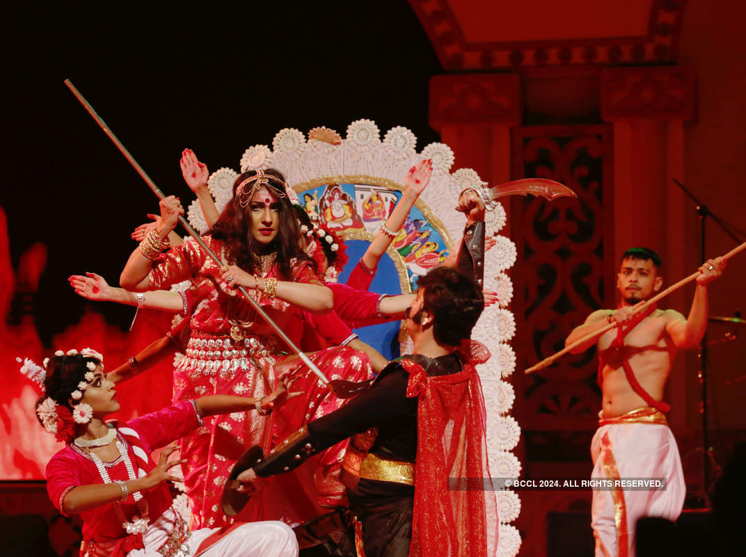 Artistes perform at a grand show to mark Durga Puja celebrations