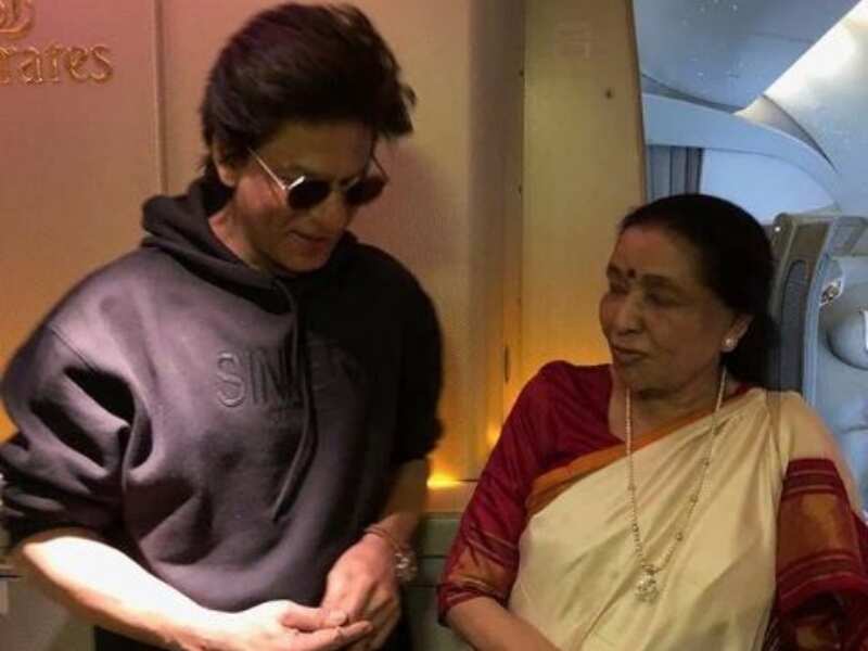 Photo: Shah Rukh Khan with singer Asha Bhosle on a flight to Dubai