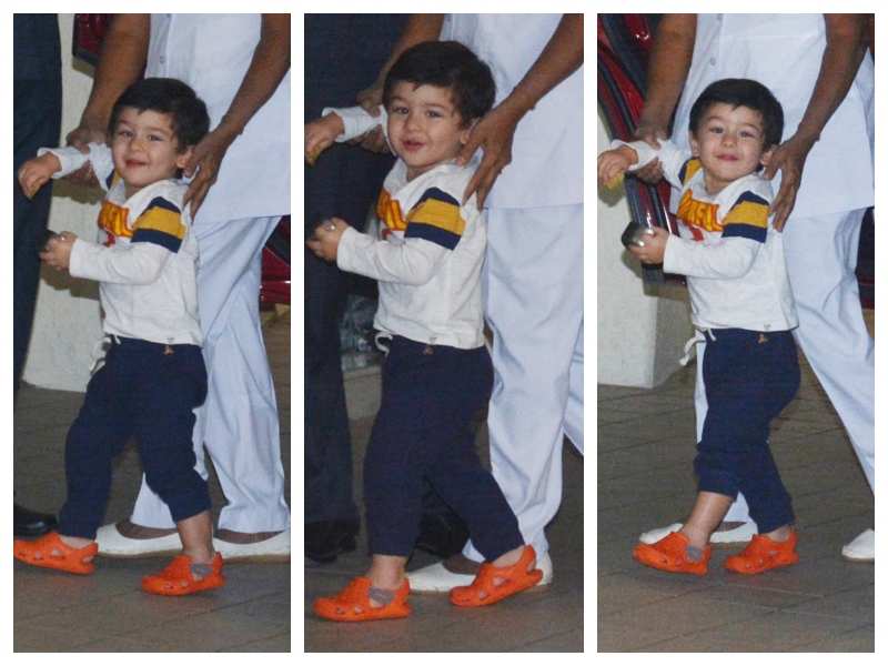 Taimur Ali Khan flashes his dazzling smile as his nanny accompanies him