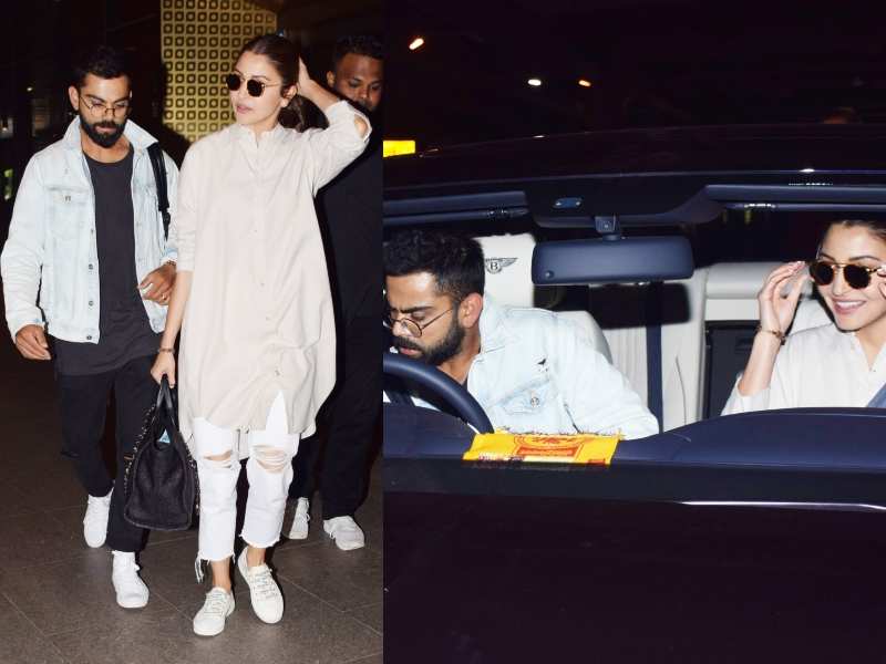 Photos: Anushka Sharma and Virat Kohli snapped at the airport as they are back to Mumbai after their romantic vacation