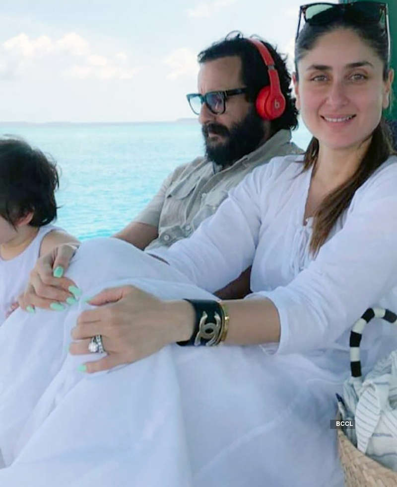 This picture of Saif Ali Khan all set to chop son Taimur's long, shaggy hair will make you smile