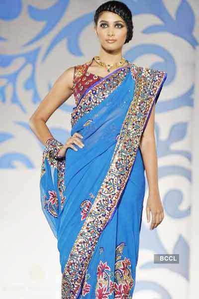 A model walks the ramp for designer Nisha Sagar during Aamby Valley ...