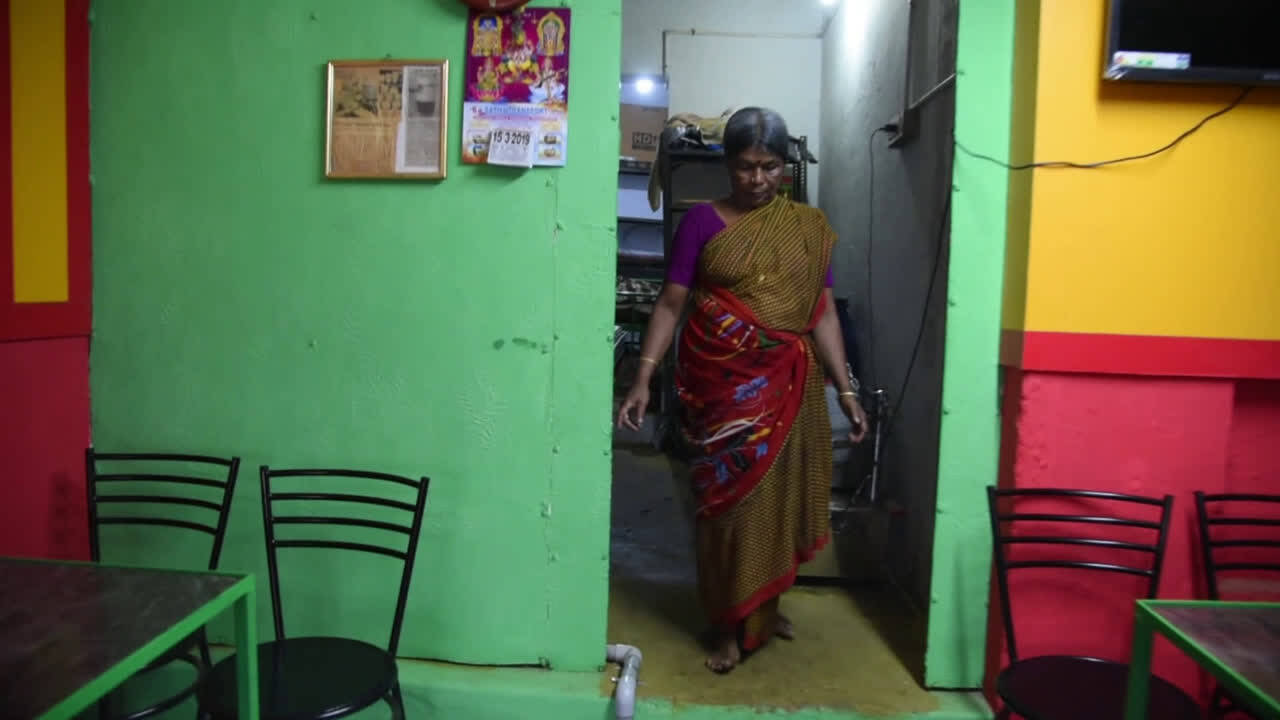 Get a glimpse of how layer milk tea is prepared by tea master Manickam