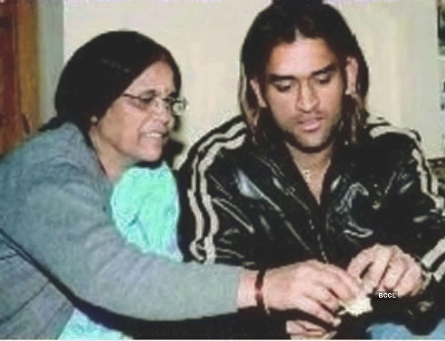 Former captain of the Indian team Mahendra Singh Dhoni and mother Devaki  Devi captured in a candid moment - Photogallery