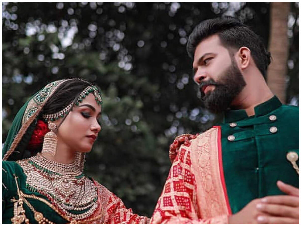 bride and groom indian wedding outfit matching green ...