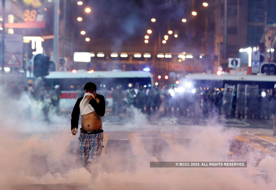 Hong Kong protesters hurl petrol bombs after police fire tear gas to clear rally