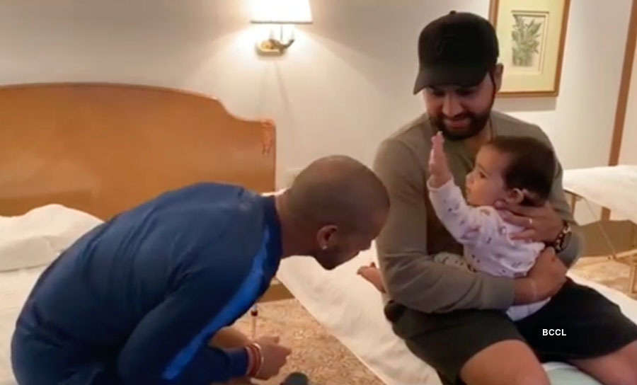 Shikhar Dhawan shows off babysitting skills as he plays with Rohit Sharma's daughter
