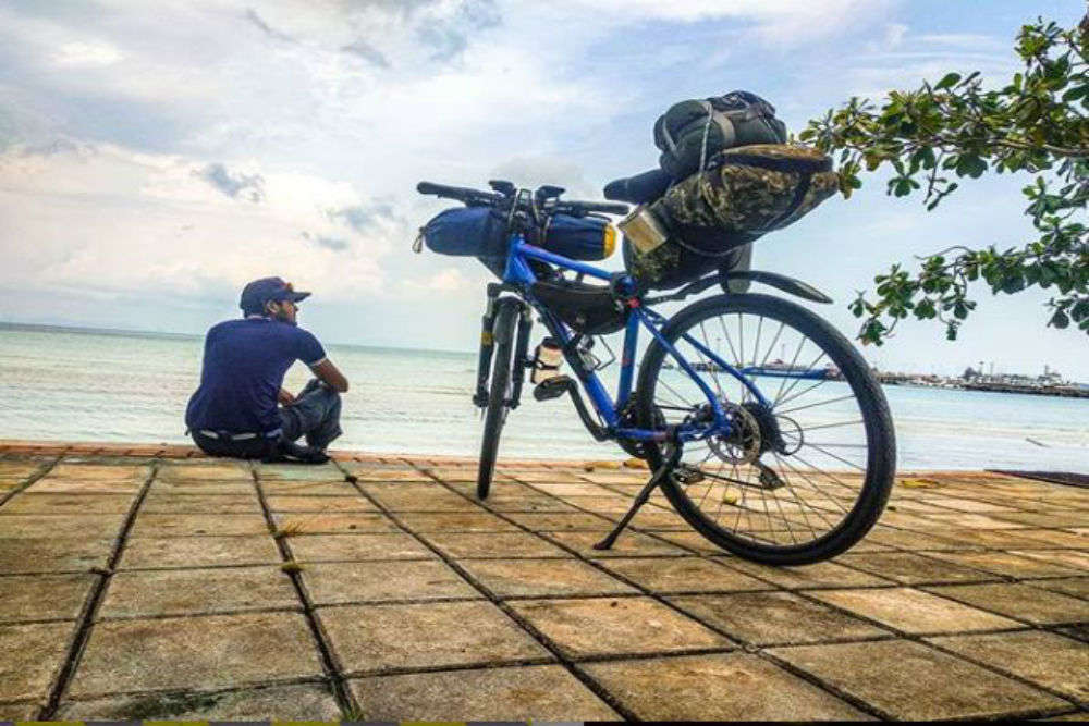 Man with outlet bicycle