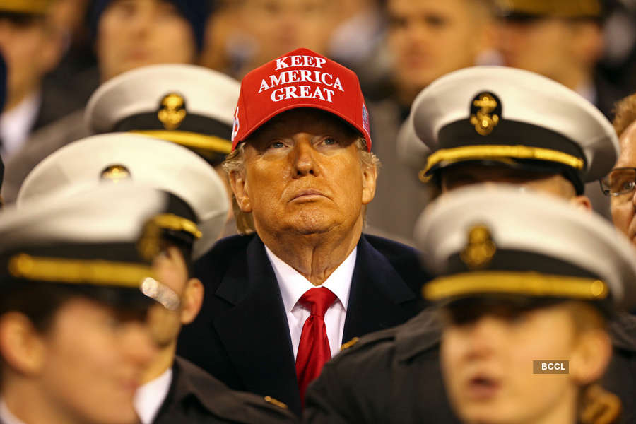 US President Donald Trump Gestures As He Watches The Army-Navy Football ...